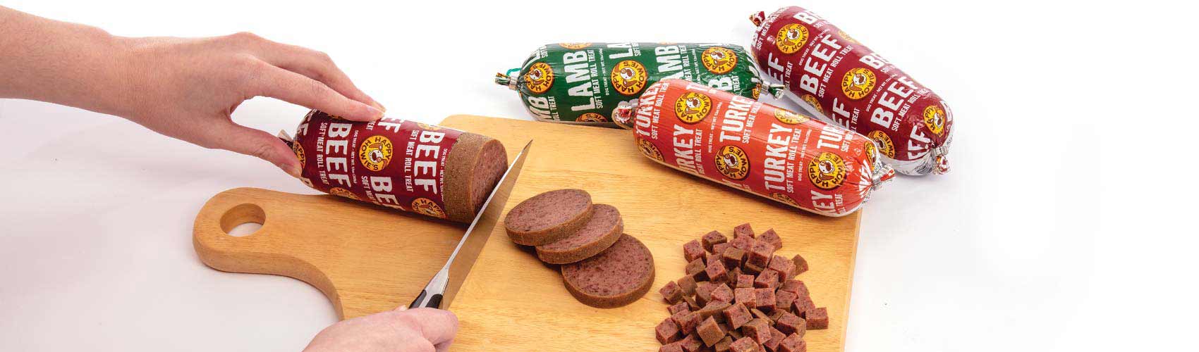hand slicing a meat roll